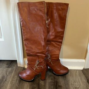 Woman’s knee high brown boots